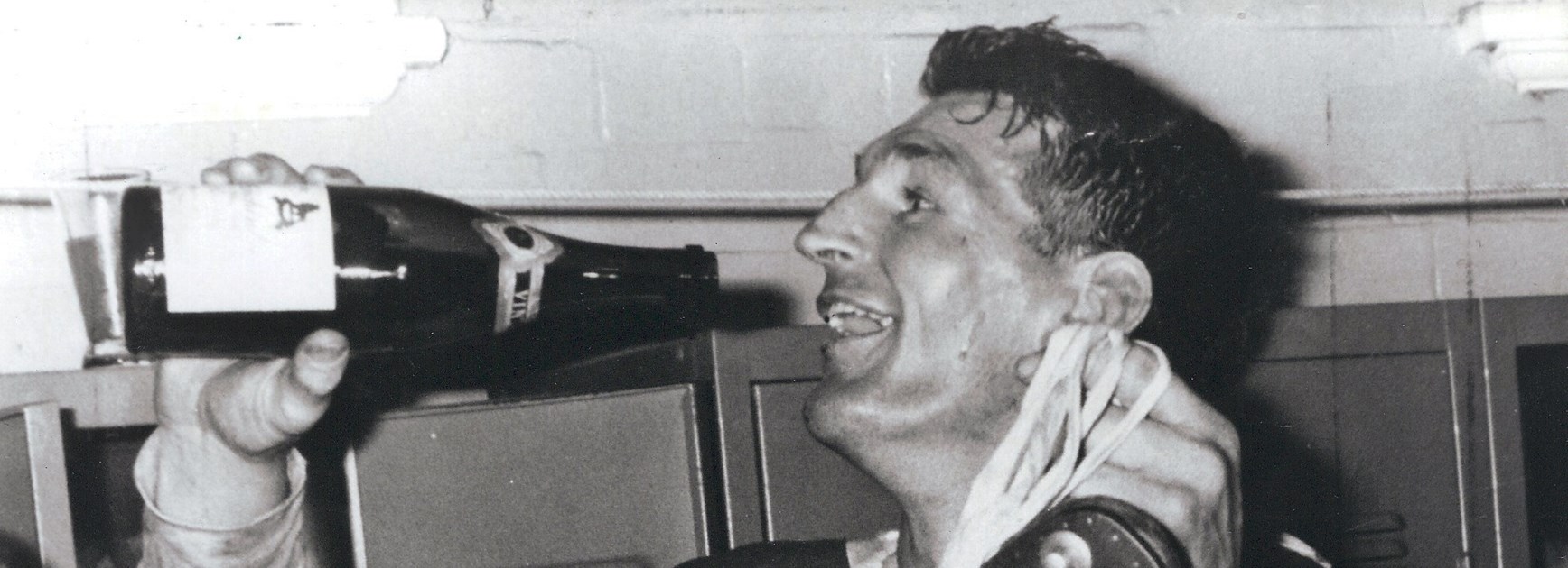 A noted teetotaller, Provan plays it up for the camera back in the dressing rooms after the 1965 Grand Final.
