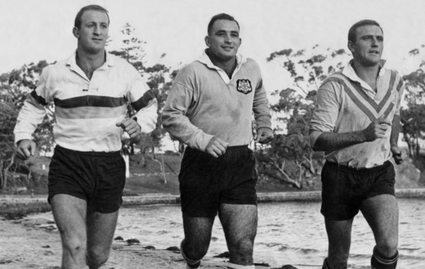 St George 'Team of the Century' inductees John Raper, Ian Walsh and Reg Gasnier running on the sand at Carrs Park in 1966.