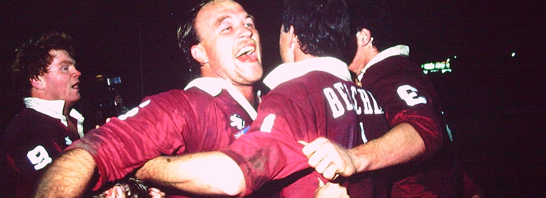 Wally Lewis embraces his Maroons teammates after their 1987 series win.