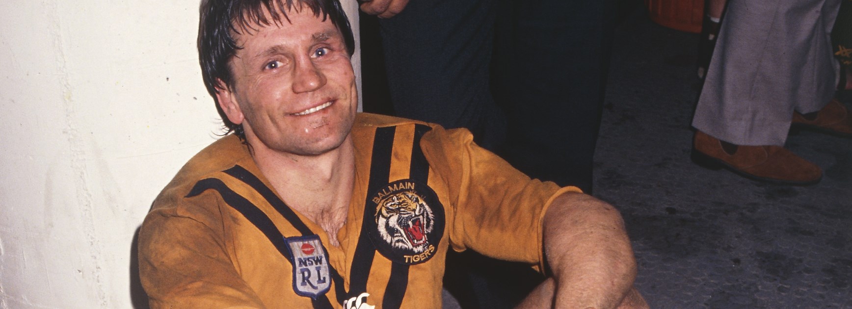 An exhausted Pearce relaxes in the dressing rooms after another Balmain win.