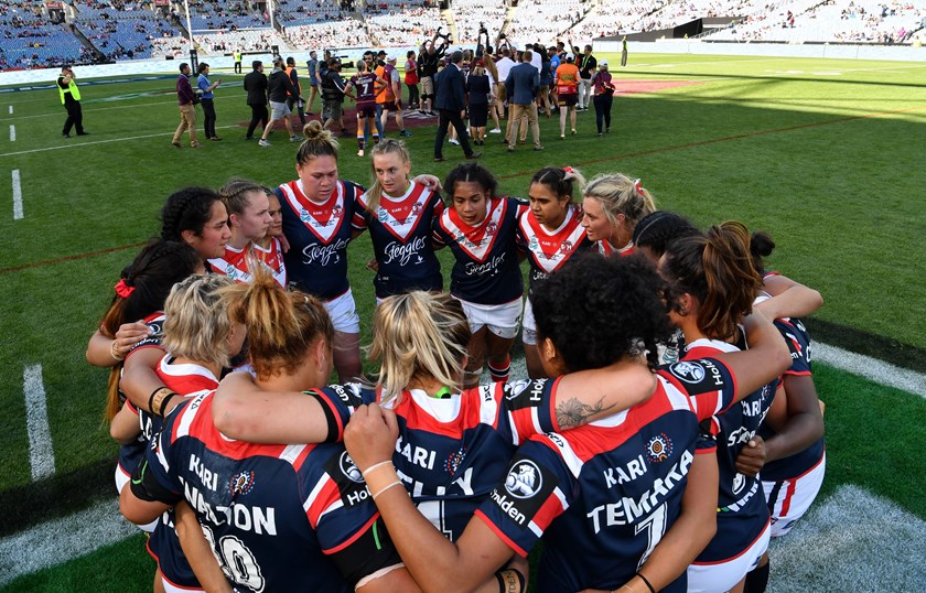 Roosters players in a huddle after losing 2018 NRLW grand final